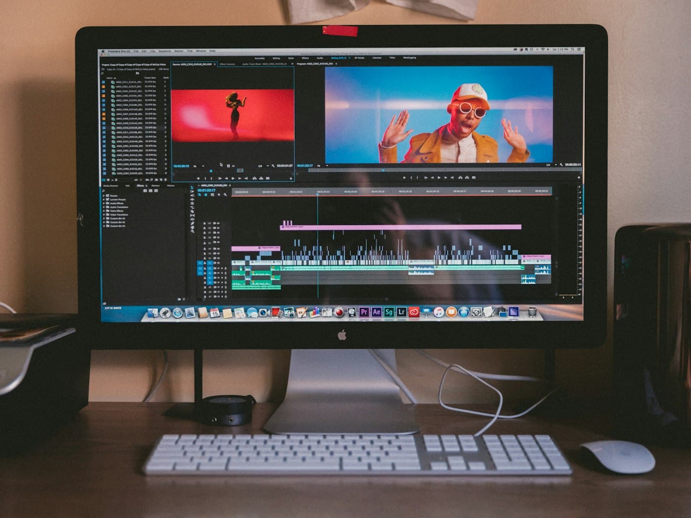 A video-editing workstation with a timeline open on the display
